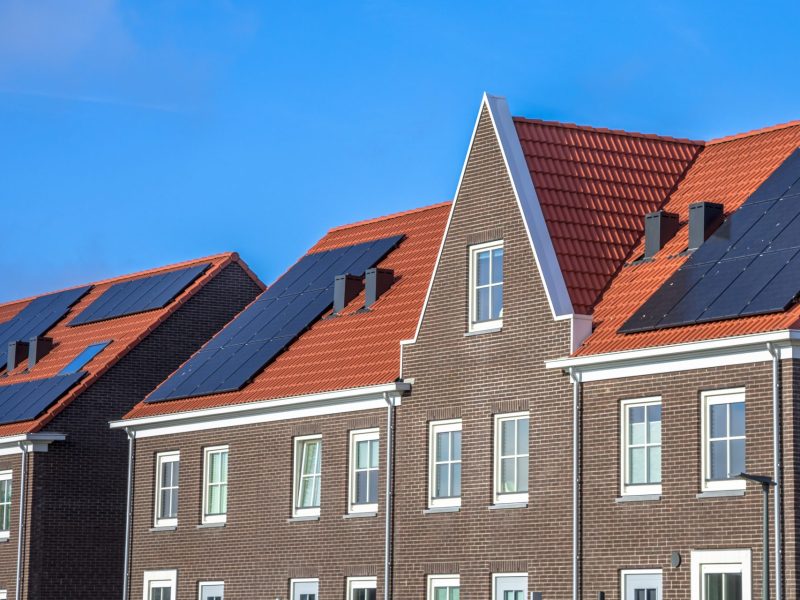close-up-of-modern-row-houses-with-solar-panels-P72ZCRD